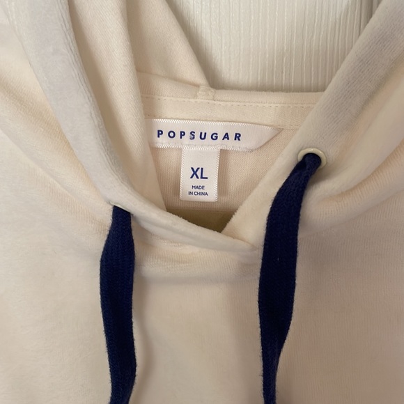 Cream hoodie with navy drawstring and star on left sleeve. Size XL. - Picture 4 of 9